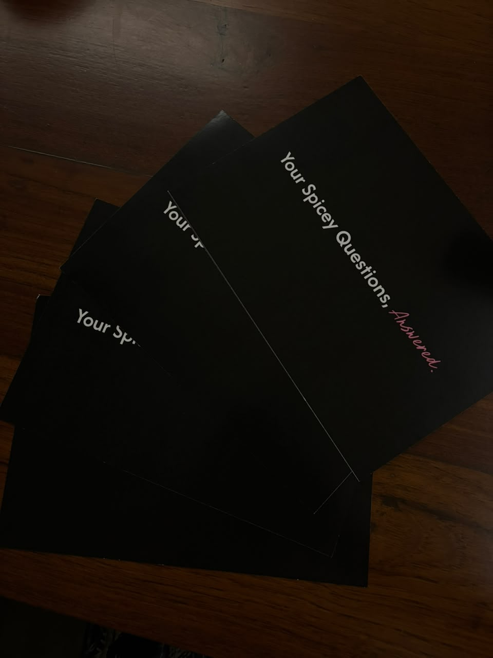 Printed 'Your Spicey Questions, Answered' deck fanned out